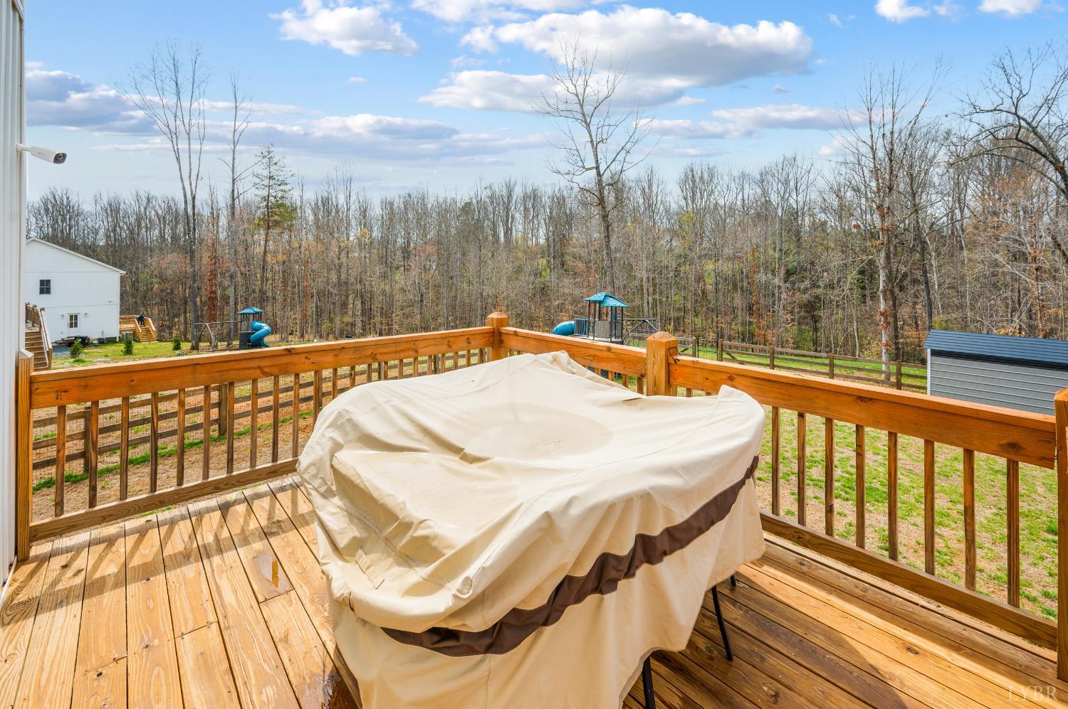 240 Ned Brown Road Amherst, VA 24521 - Photo 44 of 53 a bedroom with a bed and wooden floor