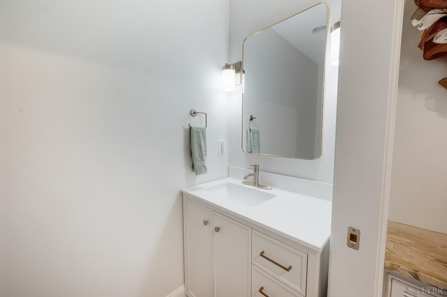 240 Ned Brown Road Amherst, VA 24521 - Photo 7 of 53 a bathroom with a sink and a mirror