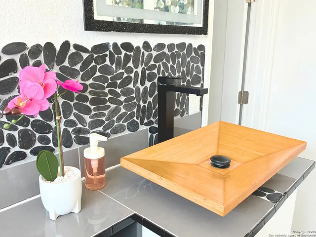 a view of a dining room with a table and chairs