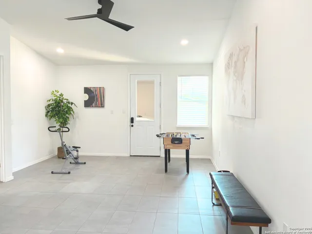 a view of a livingroom with furniture and a window