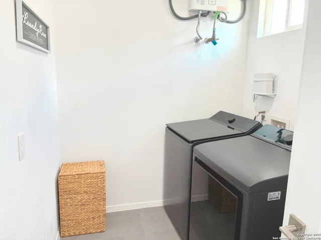 a utility room with dryer and washer