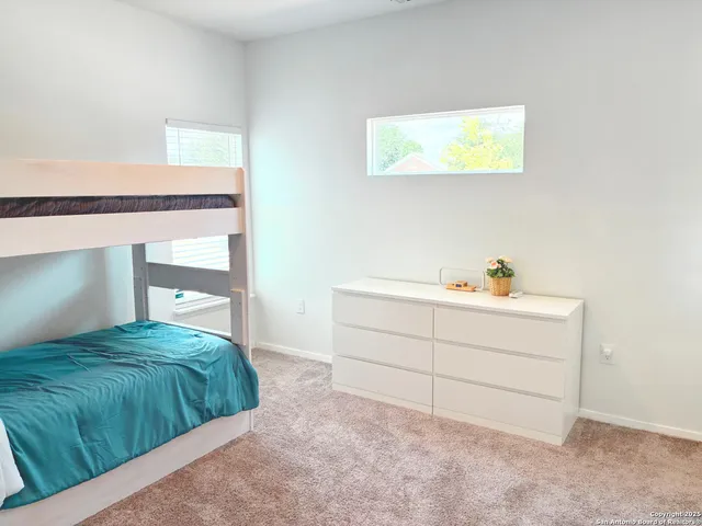 a room with a bed and a window