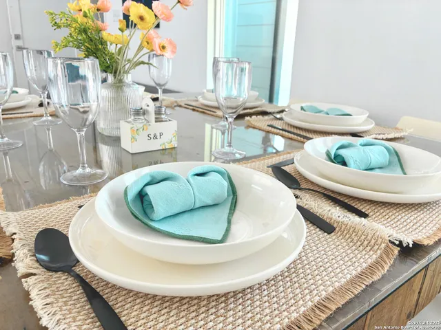 a table with a couch and potted plant