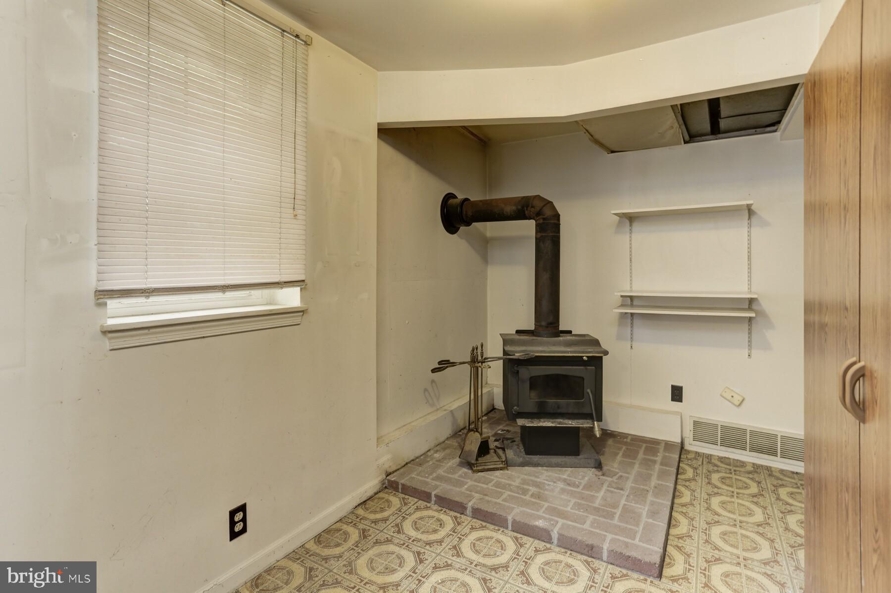 3030 Old Gamber Road Finksburg, MD 21048 - Photo 10 of 17 Wood stove in finished Lower Level