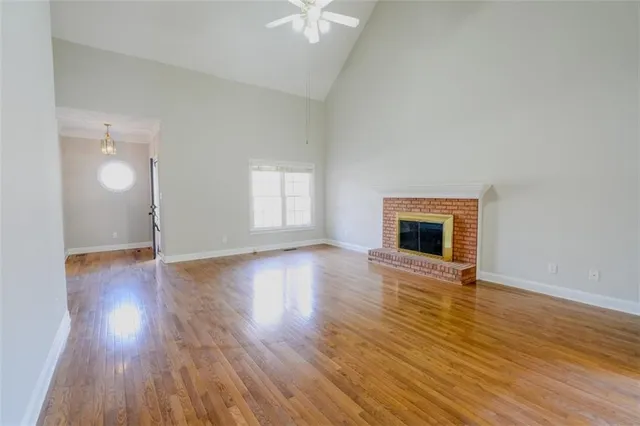 a kitchen with stainless steel appliances granite countertop a refrigerator a stove and white cabinets