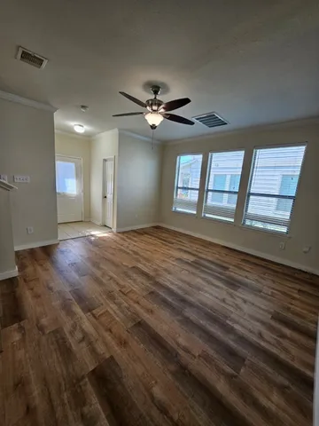 a view of an empty room with a window