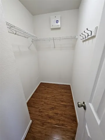 a view of a room with racks on the wall