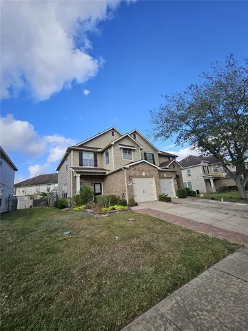 a house view with a garden space