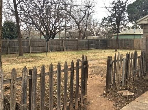 3405 24th Street Lubbock, TX 79410 - Photo 11 of 11 a view of a yard with wooden fence