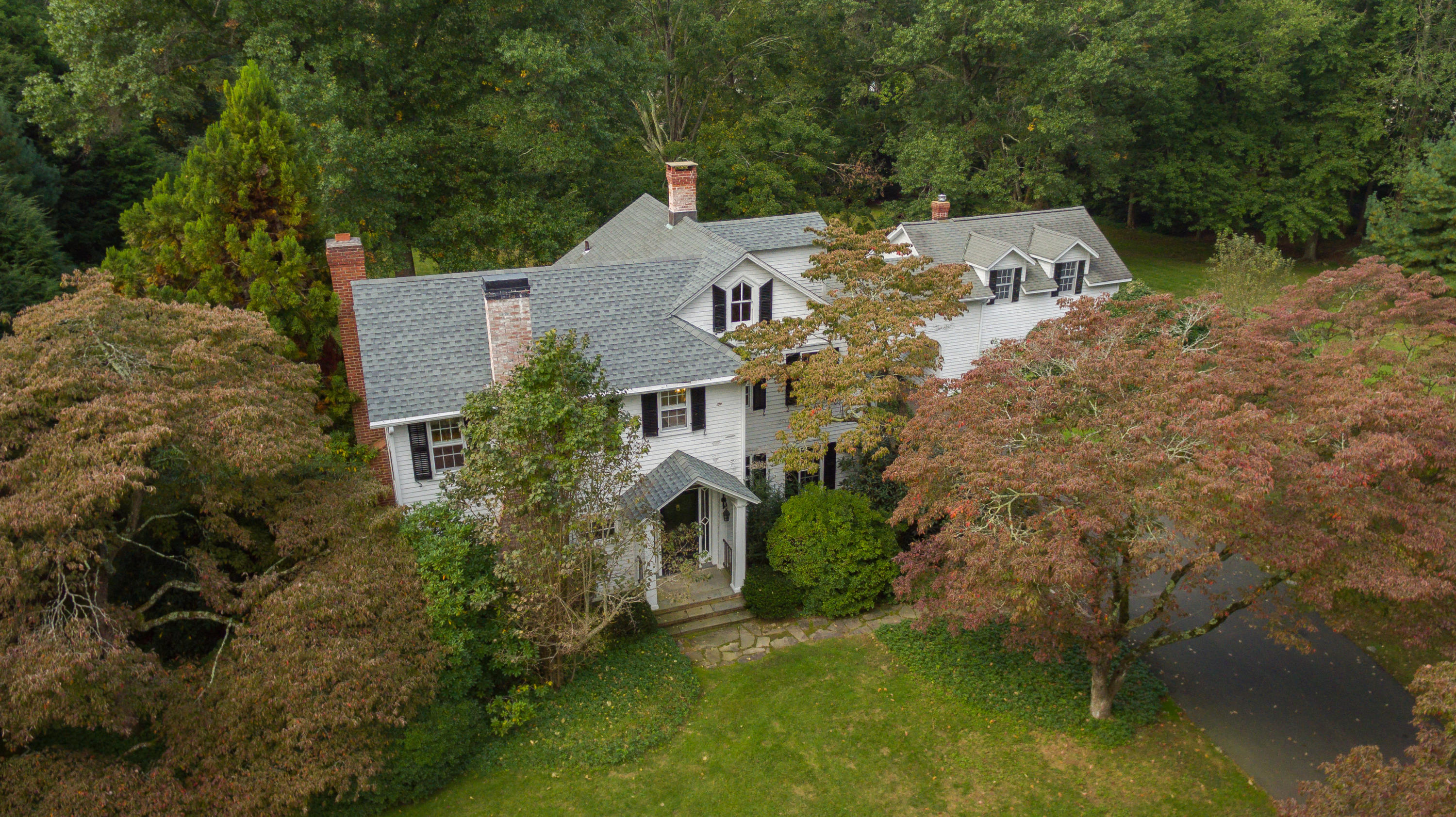 275 Hollow Tree Ridge Road Darien, CT 06820 - Photo 3 of 41 an aerial view of a house with a yard