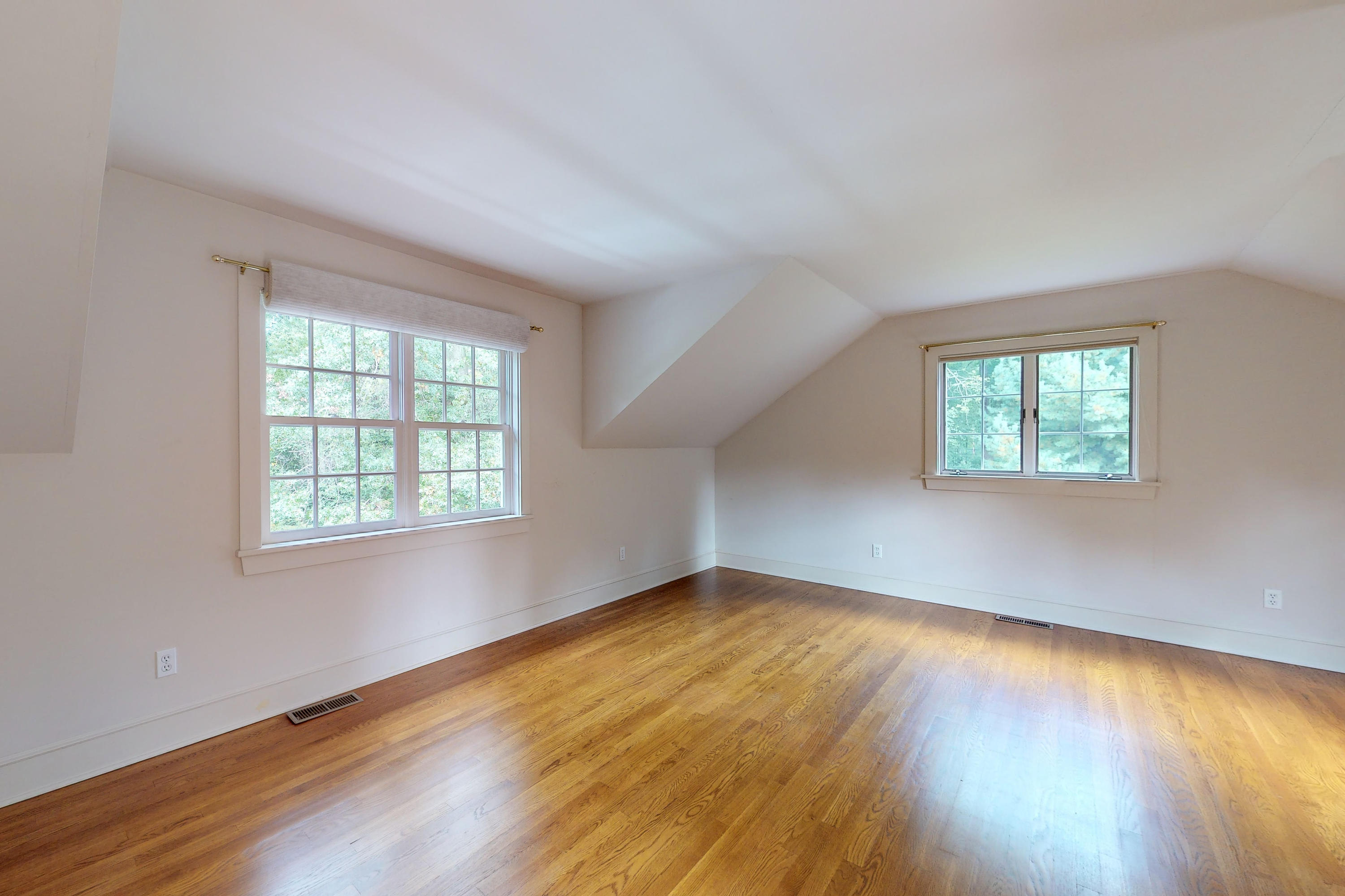 275 Hollow Tree Ridge Road Darien, CT 06820 - Photo 36 of 41 a view of an empty room with wooden floor and a window