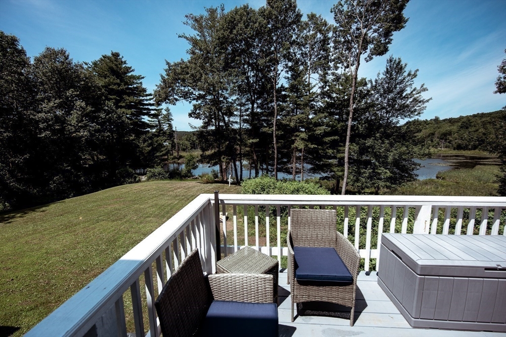 a view of a two chairs in the deck