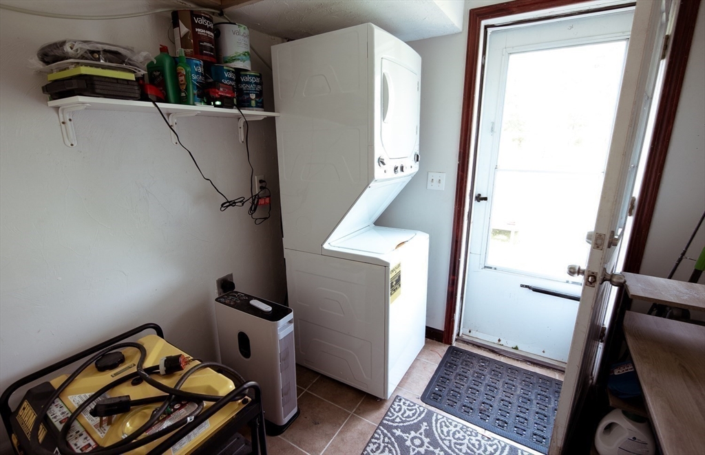 1124 Bemis Road, Unit A Warren, MA 01585 - Photo 24 of 33 a view of walk in closet with clothes and shoes