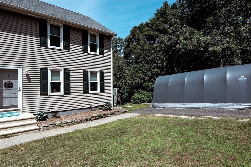 1124 Bemis Road, Unit A Warren, MA 01585 - Photo 6 of 33 a backyard of a house