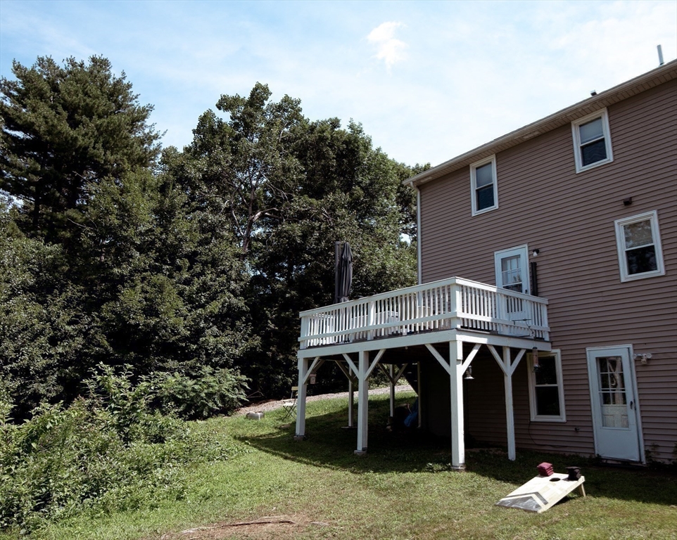 1124 Bemis Road, Unit A Warren, MA 01585 - Photo 8 of 33 a view of a house with a yard balcony and sitting area