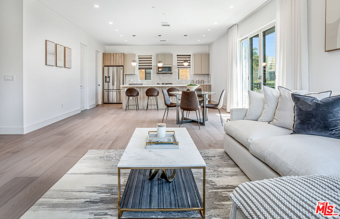 1573 Hi Point Street Los Angeles, CA 90035 - Photo 12 of 56 a living room with furniture and a table