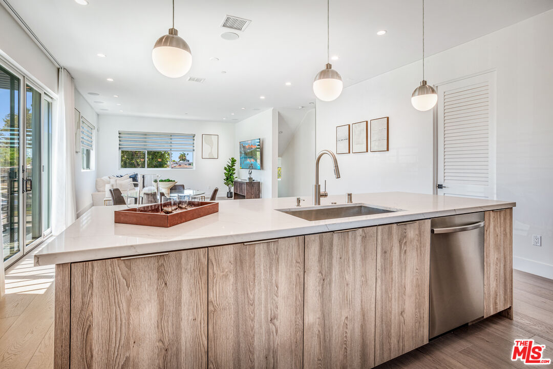1573 Hi Point Street Los Angeles, CA 90035 - Photo 16 of 56 a kitchen with counter top space and a sink