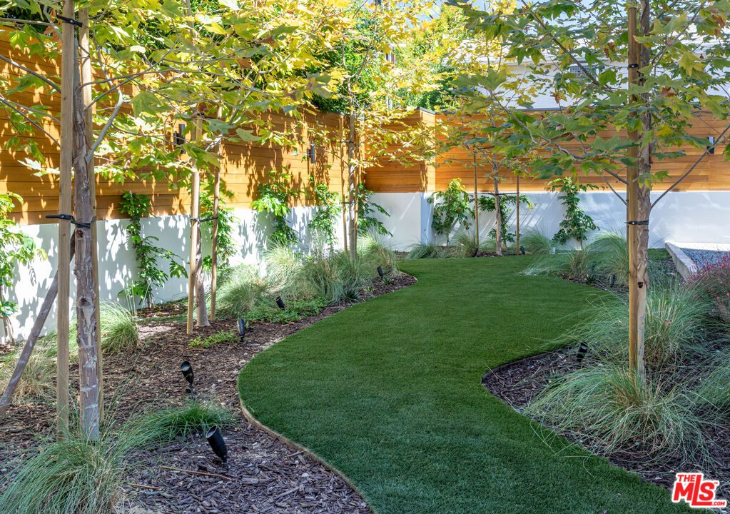 1573 Hi Point Street Los Angeles, CA 90035 - Photo 2 of 56 a view of a garden with trees