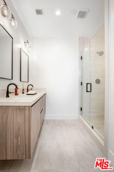 1573 Hi Point Street Los Angeles, CA 90035 - Photo 23 of 56 a spacious bathroom with a bathtub and a sink