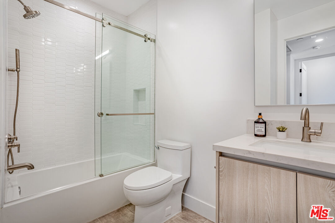 1573 Hi Point Street Los Angeles, CA 90035 - Photo 27 of 56 a bathroom with a sink toilet and shower