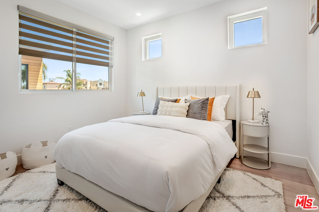 1573 Hi Point Street Los Angeles, CA 90035 - Photo 29 of 56 a bedroom with a bed and a window