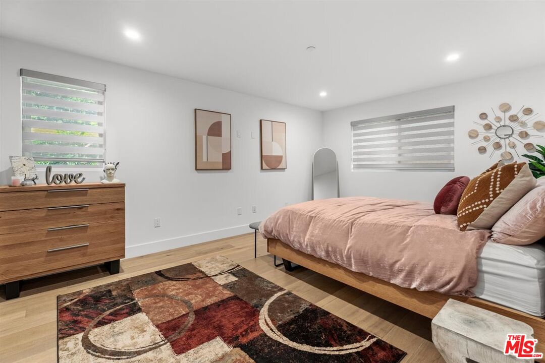 1573 Hi Point Street Los Angeles, CA 90035 - Photo 36 of 56 a bedroom with a bed and closet