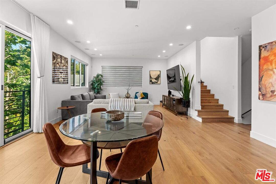 1573 Hi Point Street Los Angeles, CA 90035 - Photo 44 of 56 a view of a dining room with furniture and wooden floor