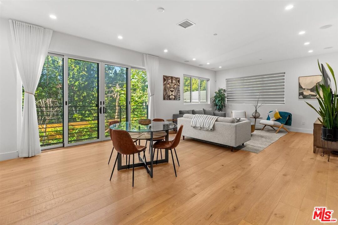 1573 Hi Point Street Los Angeles, CA 90035 - Photo 47 of 56 a living room with furniture and a wooden floor