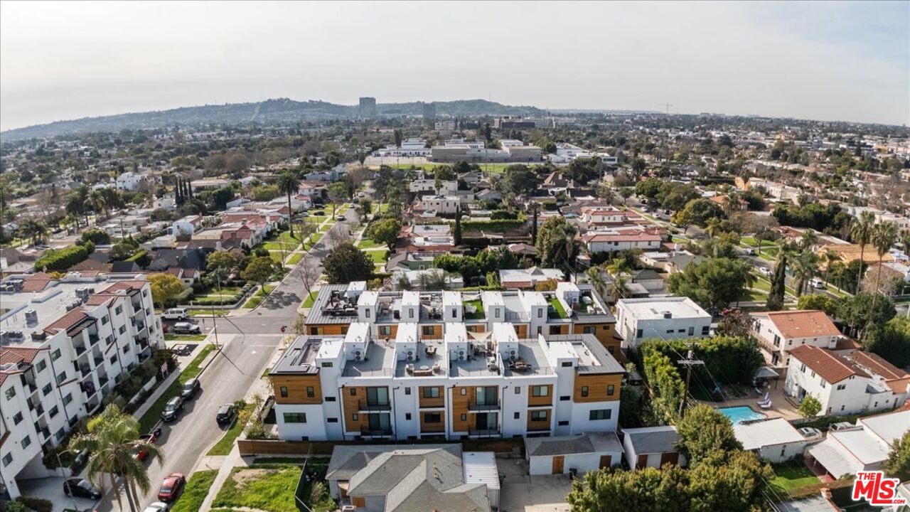 1573 Hi Point Street Los Angeles, CA 90035 - Photo 49 of 56 an aerial view of residential building with parking