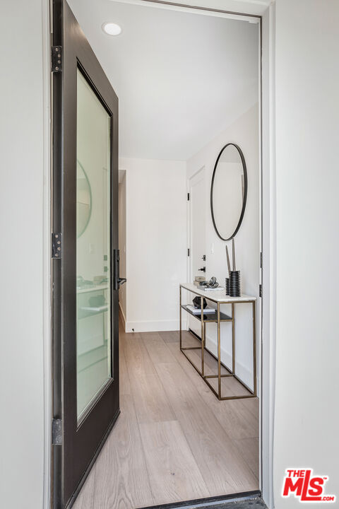 1573 Hi Point Street Los Angeles, CA 90035 - Photo 5 of 56 a view of a room with a table and chairs