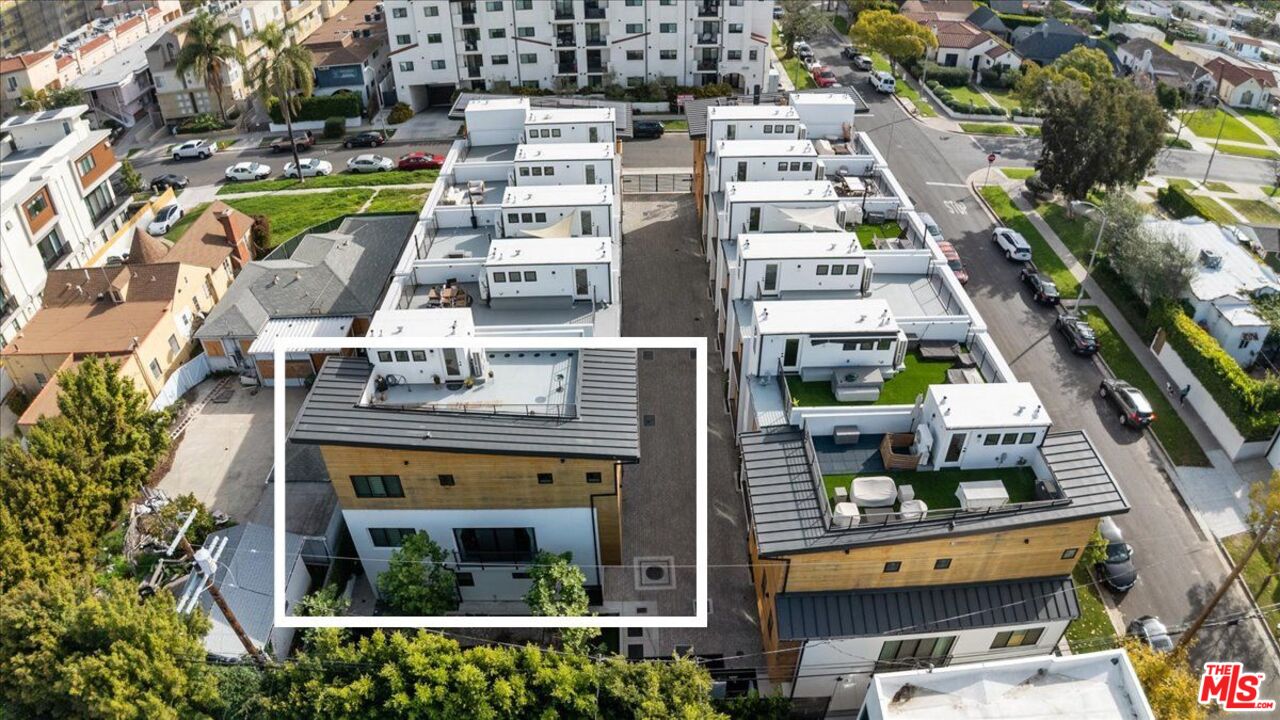 1573 Hi Point Street Los Angeles, CA 90035 - Photo 54 of 56 an aerial view of a residential apartment building with a yard