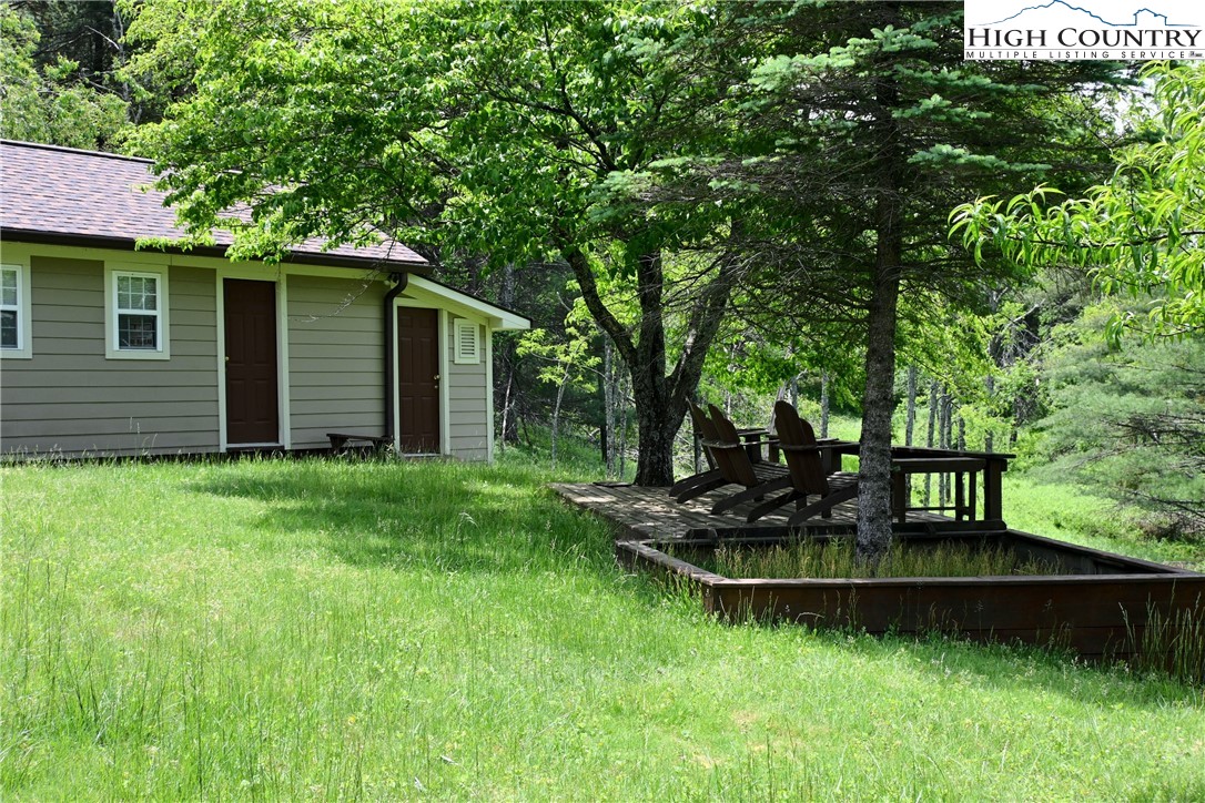 280 Smoky Hollow Road Laurel Springs, NC 28644 - Photo 29 of 42 a view of a house with backyard and garden