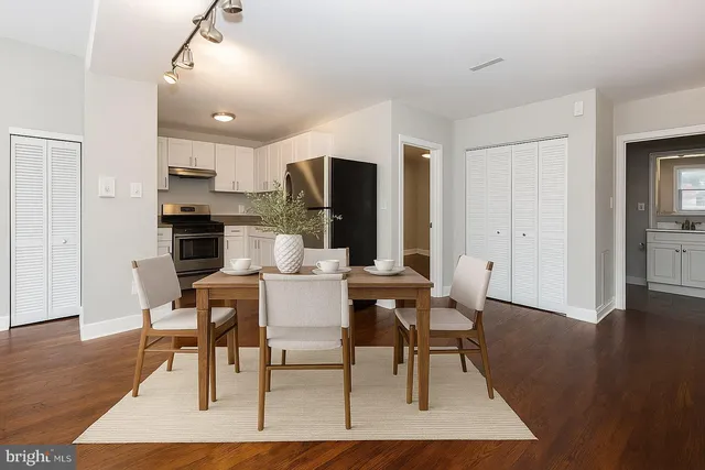 a view of a dining room with furniture and wooden floor