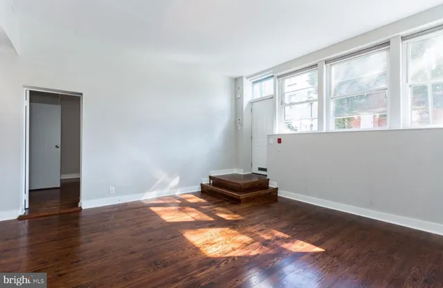 a view of livingroom with hardwood floor and a window