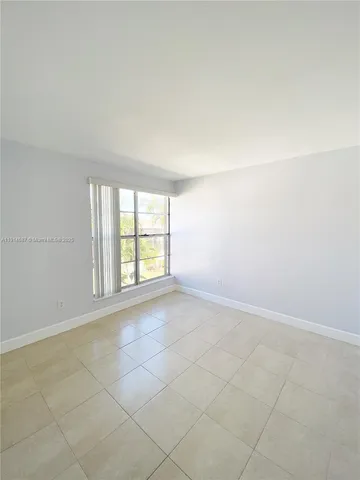 an empty room with a empty space and a window