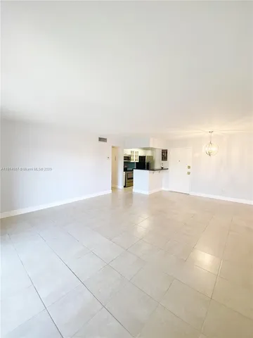 a view of open kitchen with furniture and cabinets