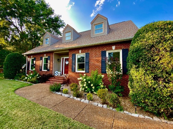 front view of a house with a yard