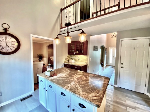 7404 Hoods Branch Road Springfield, TN 37172 - Photo 19 of 50 a kitchen with stainless steel appliances granite countertop a stove and a wooden floor