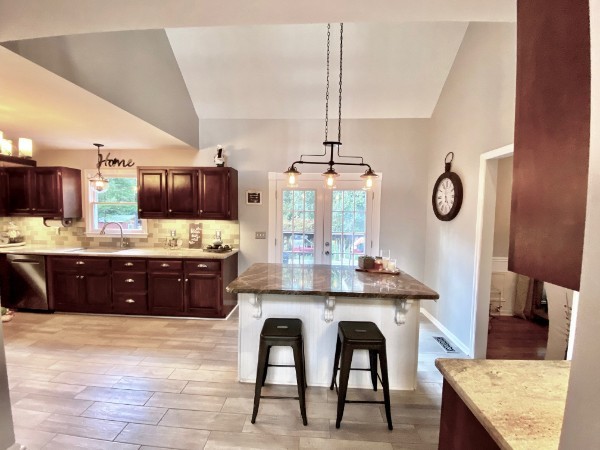 7404 Hoods Branch Road Springfield, TN 37172 - Photo 20 of 50 a kitchen with stainless steel appliances granite countertop a sink counter space and chairs in it