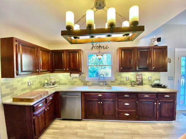 7404 Hoods Branch Road Springfield, TN 37172 - Photo 21 of 50 a kitchen with a sink and wooden cabinets