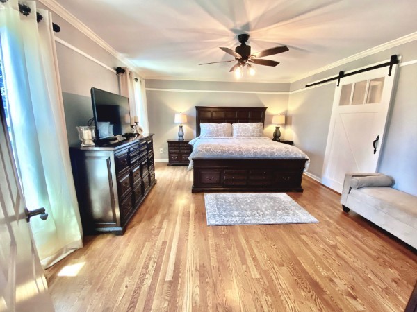7404 Hoods Branch Road Springfield, TN 37172 - Photo 24 of 50 a bedroom with a bed and a flat screen tv