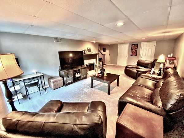 7404 Hoods Branch Road Springfield, TN 37172 - Photo 29 of 50 a living room with furniture and a flat screen tv