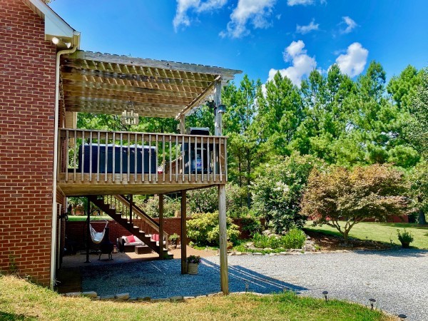 7404 Hoods Branch Road Springfield, TN 37172 - Photo 32 of 50 a view of a patio with table and chairs and potted plants