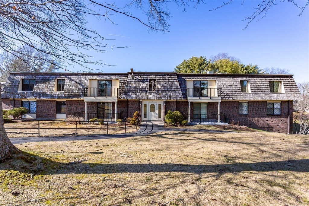 4700 North Main Street, Unit 1K Fall River, MA 02720 - Photo 2 of 18 a view of a house with a swimming pool