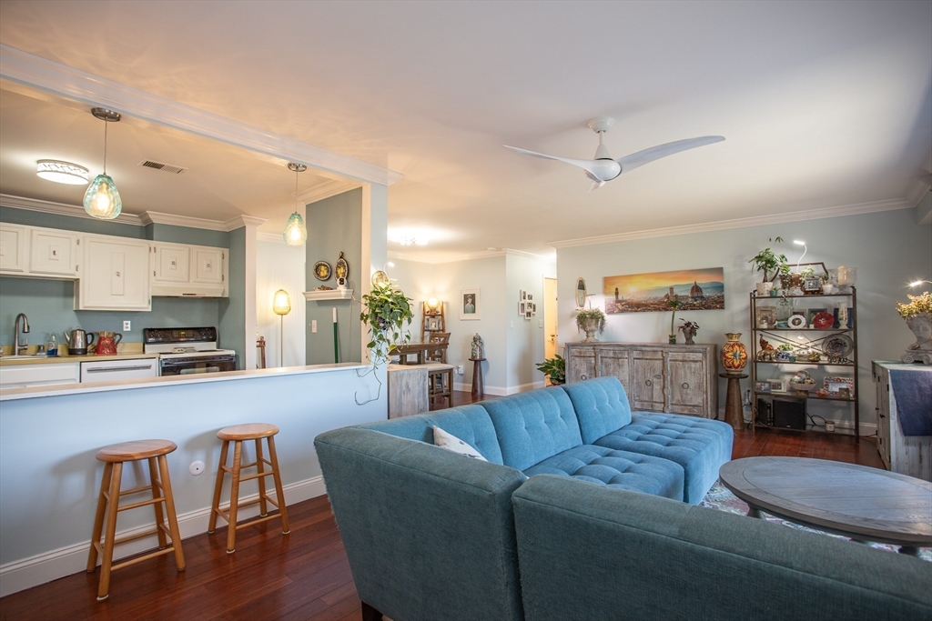 4700 North Main Street, Unit 1K Fall River, MA 02720 - Photo 3 of 18 a living room with furniture and kitchen view