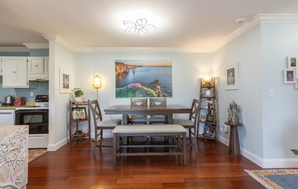 4700 North Main Street, Unit 1K Fall River, MA 02720 - Photo 5 of 18 a living room with furniture and a wooden floor