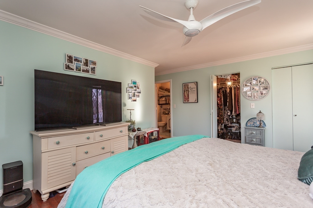 4700 North Main Street, Unit 1K Fall River, MA 02720 - Photo 9 of 18 a bedroom with a bed and a flat screen tv