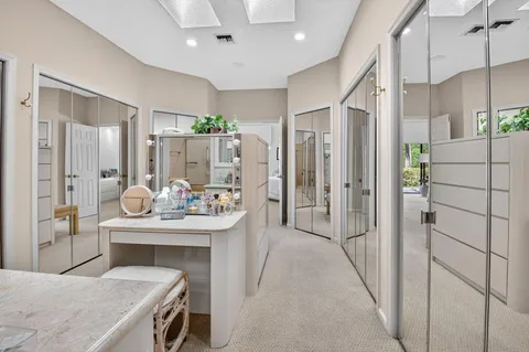 a kitchen with stainless steel appliances kitchen island granite countertop a refrigerator and a stove