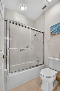 a bathroom with a shower and a toilet