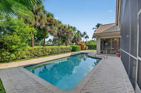 a view of swimming pool with chairs